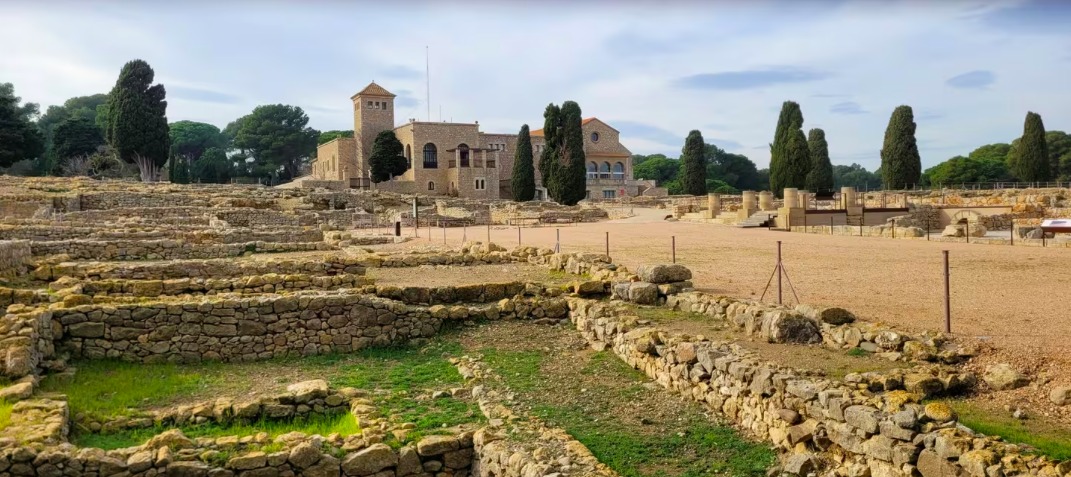 Stone foundations of the Empúries Greco-Roman ruins near the coast